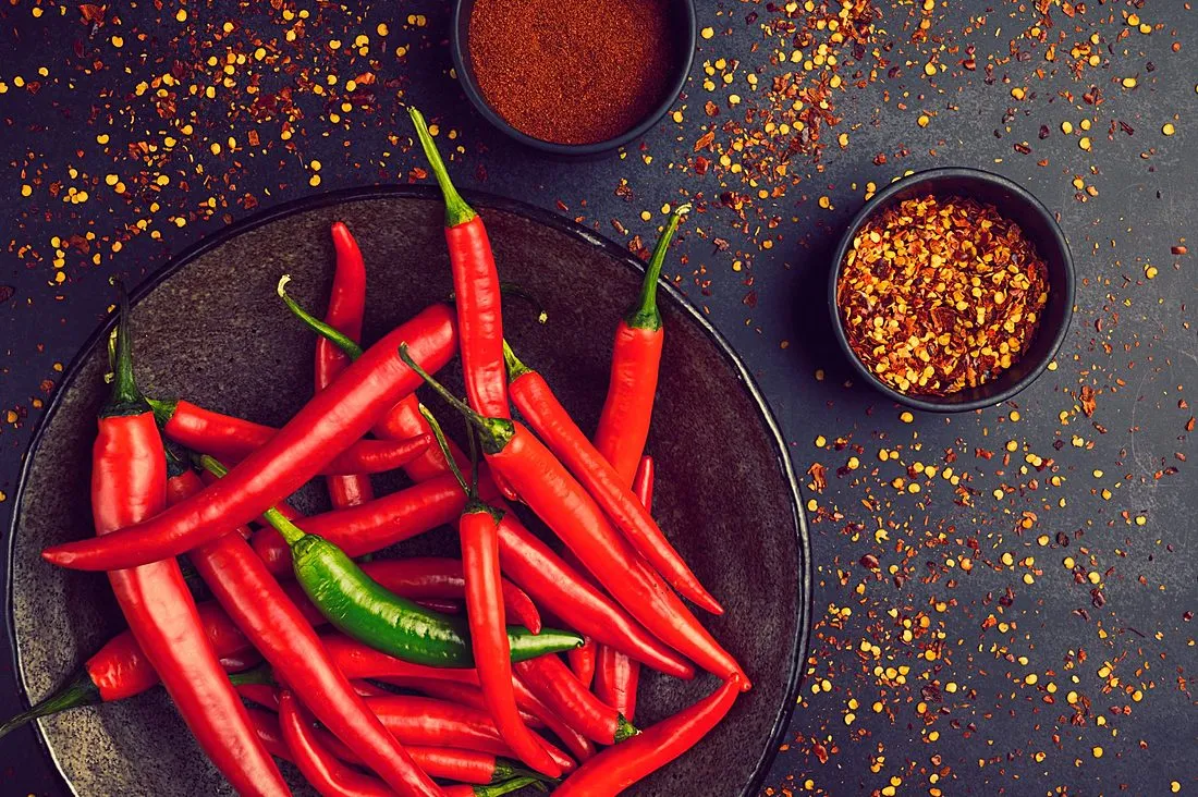 a bowl of fresh red chili peppers