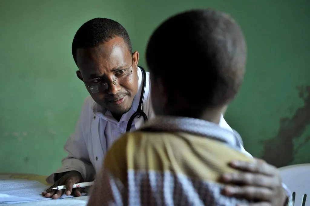 a doctor speaking with a patient in a clinical setting