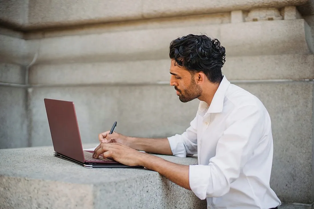 a physicist working at a laptop