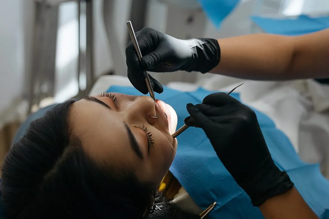 a dentist examining a patient's mouth