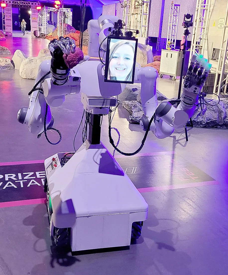 a humanoid robot hand holding a small object