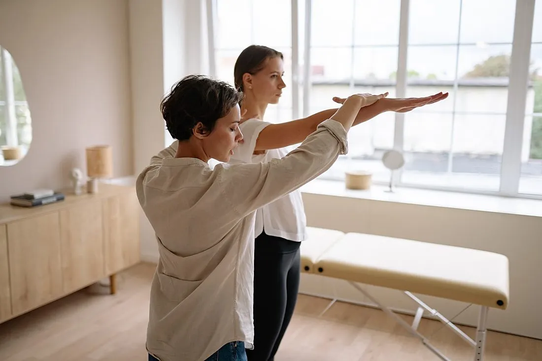 a person practicing a new physical skill in a rehabilitation lab