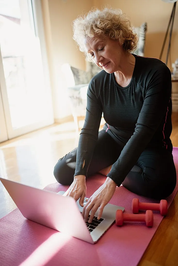 an older woman exercising outdoors