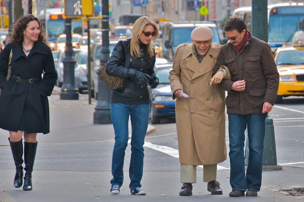 elderly couple walking in park