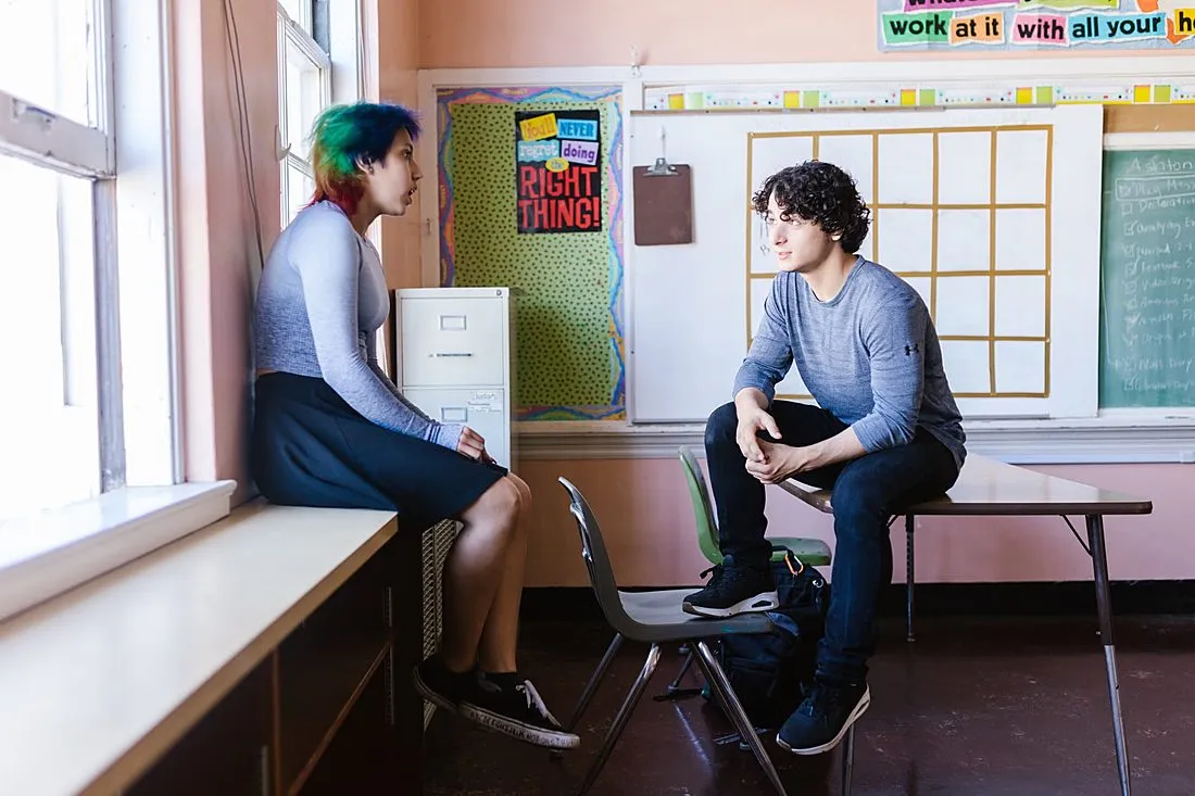 two teenagers having a conversation