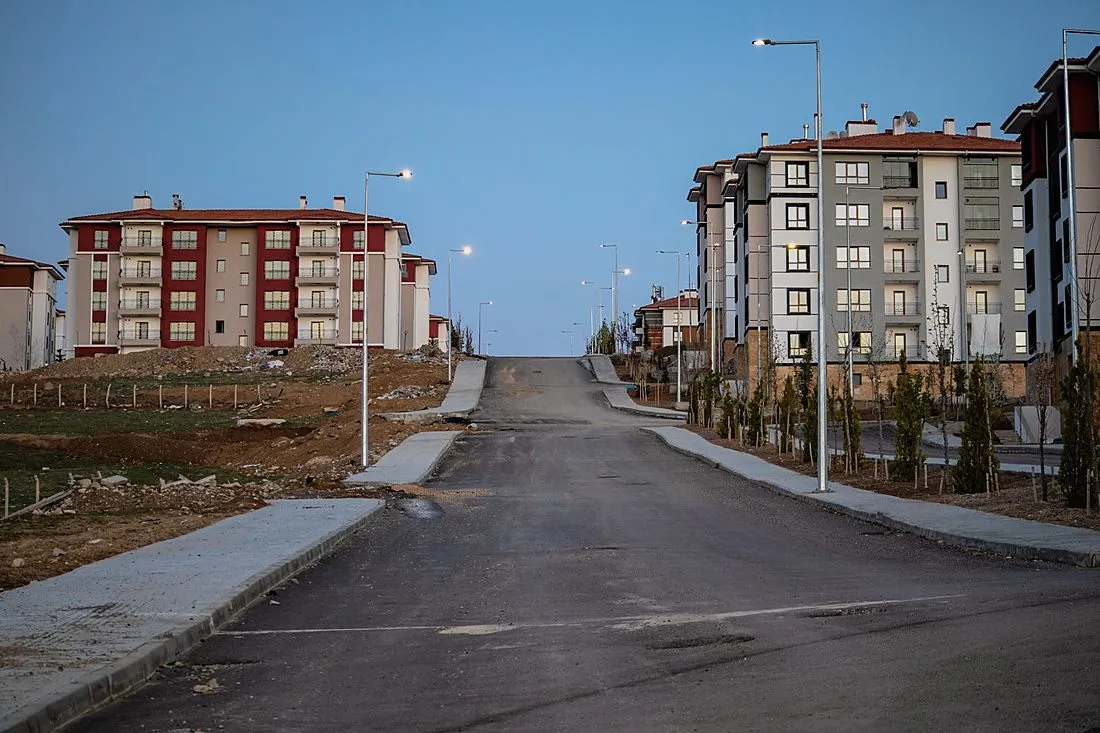 a row of newly built apartment buildings under construction