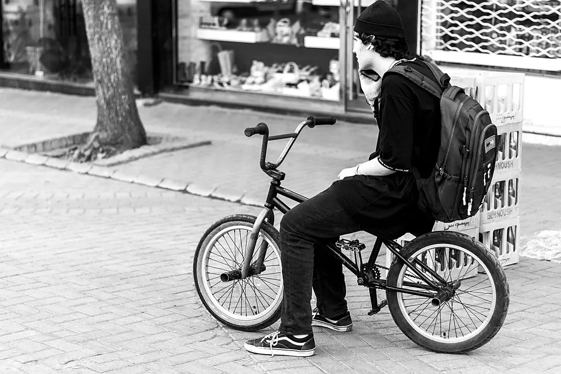 a teenager on a bicycle