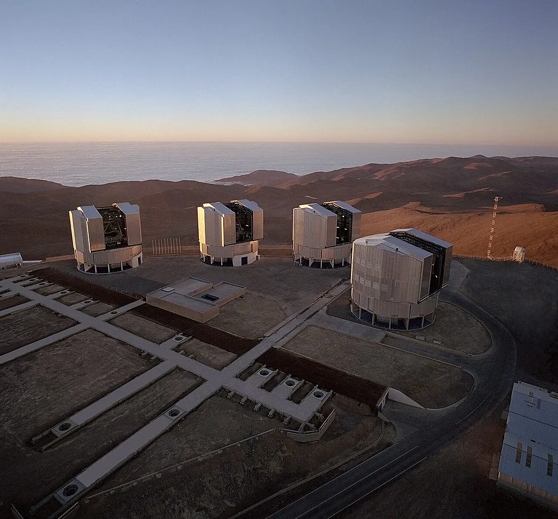 a large observatory telescope dome at night under stars