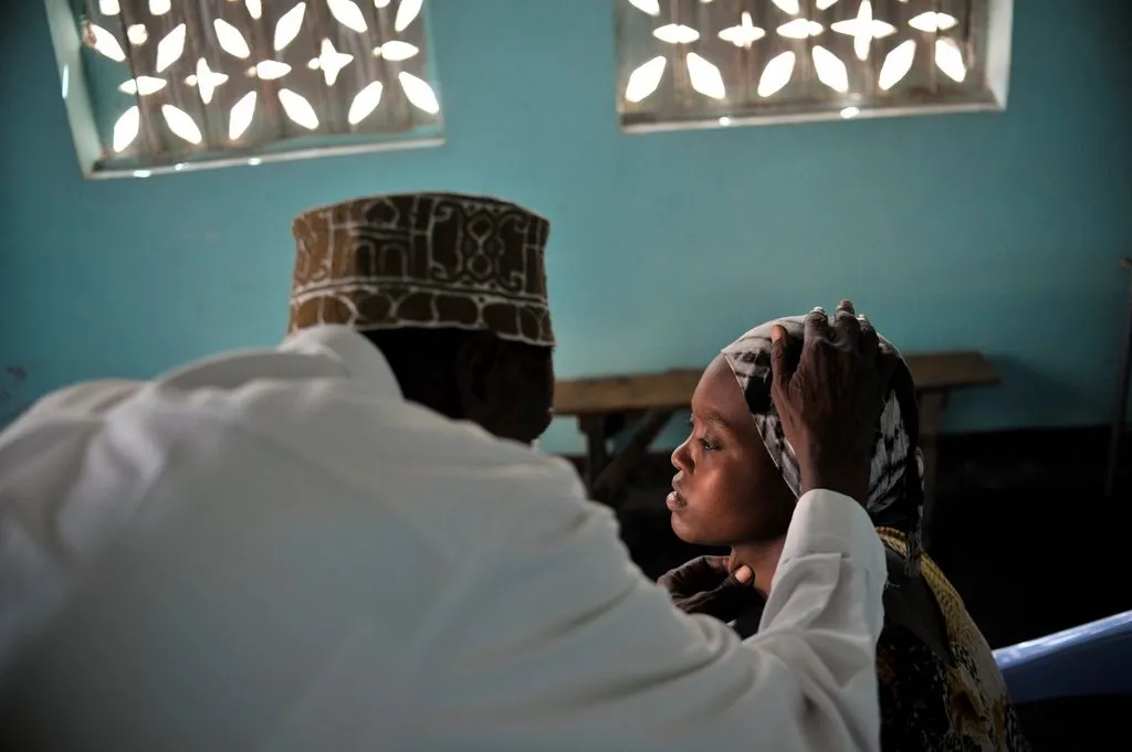 doctor examining a patient's foot at a diabetes clinic