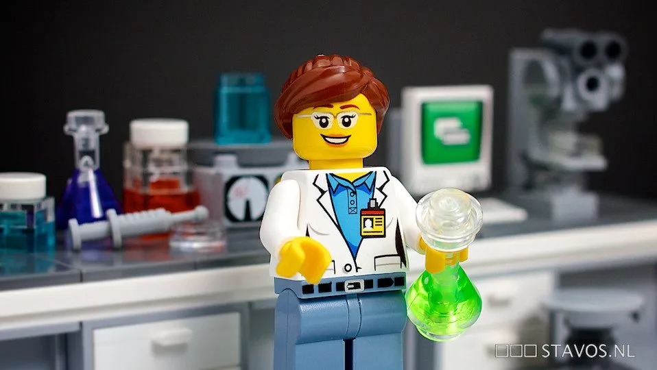 scientist working at microscope in laboratory