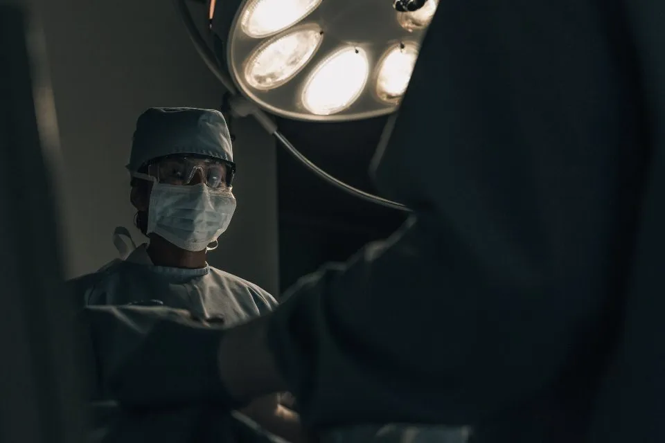 a surgeon in a modern hospital operating room