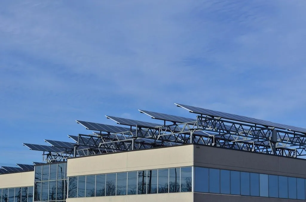 rooftop solar panels on homes in a Pakistani city