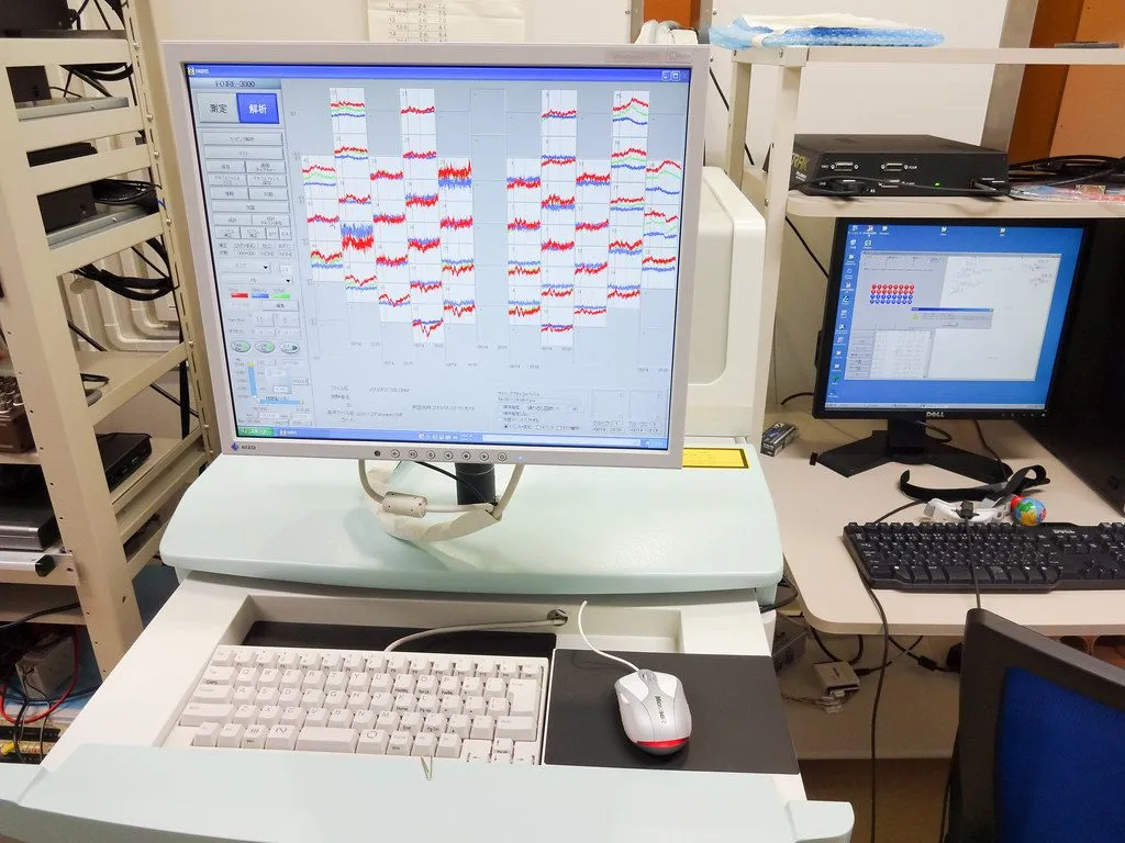 neuroscience researcher at computer monitors