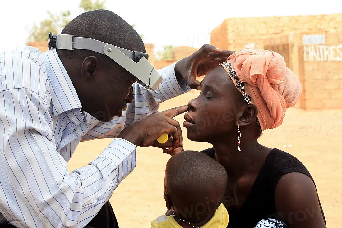 an eye doctor examining a patient's eye