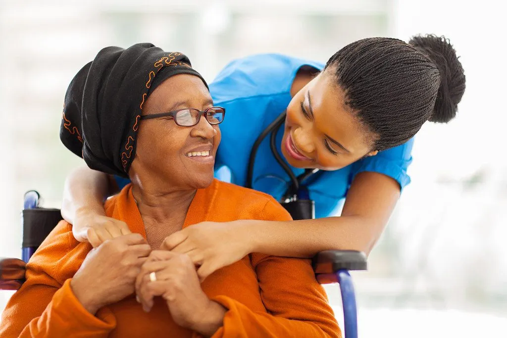 elderly woman with caregiver at home