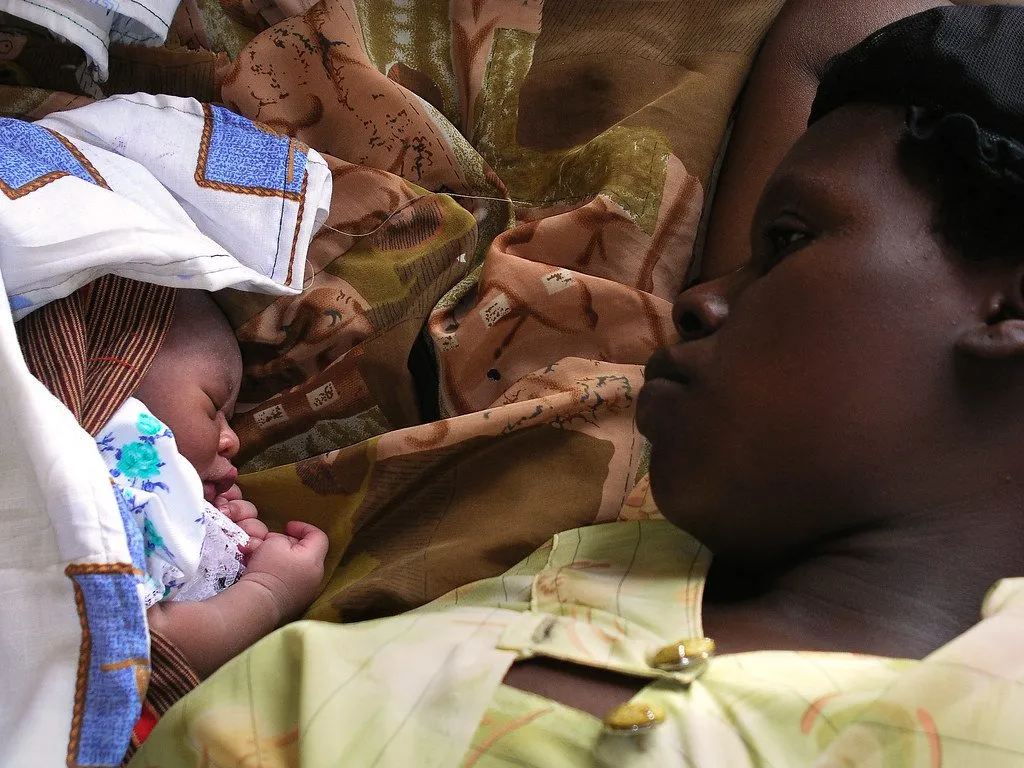 mother holding newborn baby