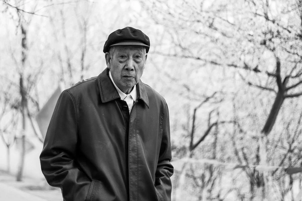 elderly man taking a walk in the park