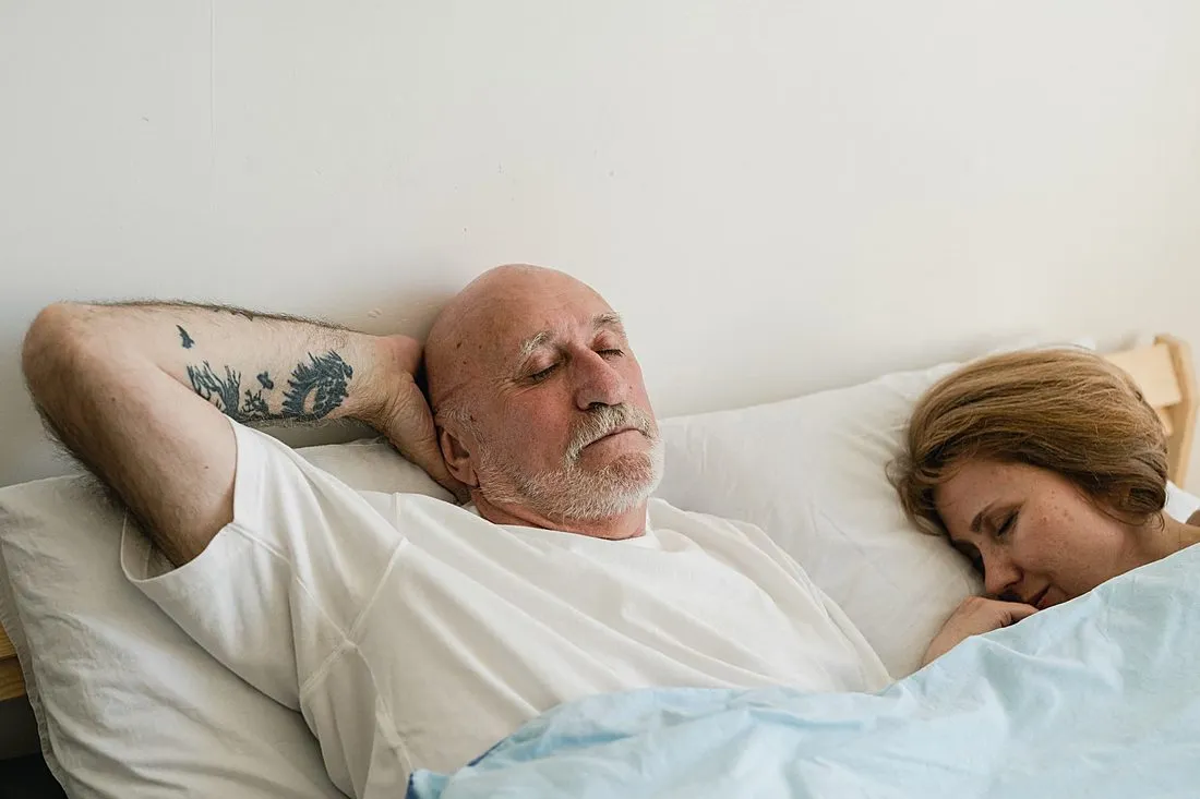 an older couple sleeping peacefully