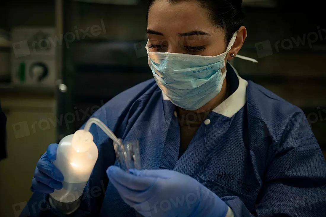 research scientist working with laboratory mice
